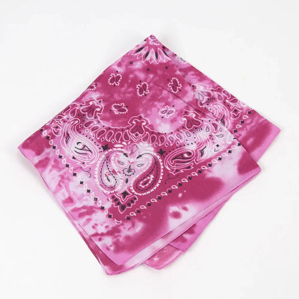 Pink tie-dye bandana featuring intricate paisley patterns and decorative borders