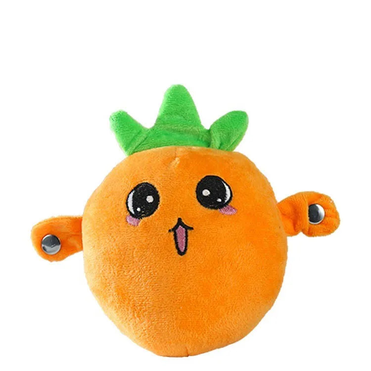 An orange fruit-shaped plush metronome toy with green leaves and musical sounds.