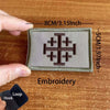 A square embroidered tactical patch featuring a Templar cross design on a green fabric background.