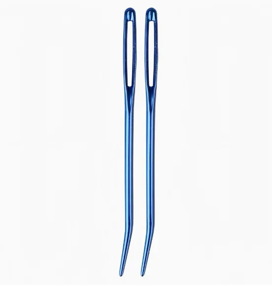 A pair of blue tapestry needles with curved tips for knitting and sewing.
