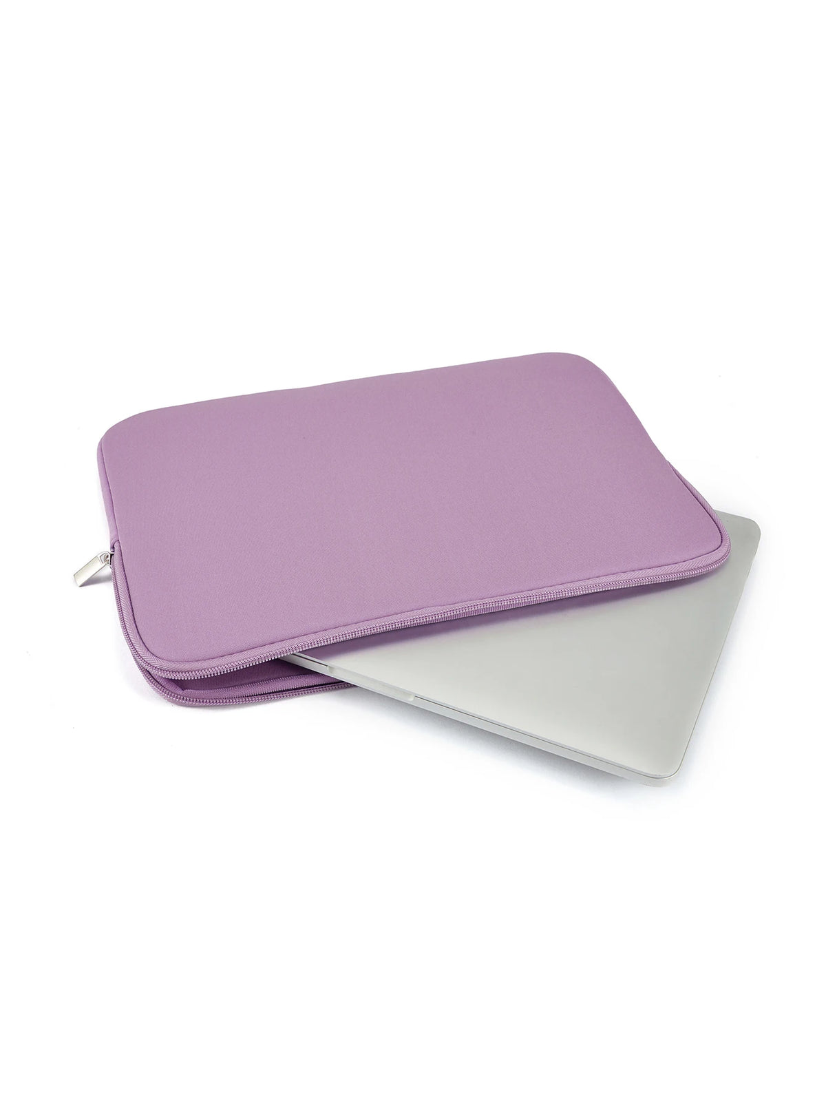 A purple laptop sleeve with a zipper closure placed next to a silver laptop.
