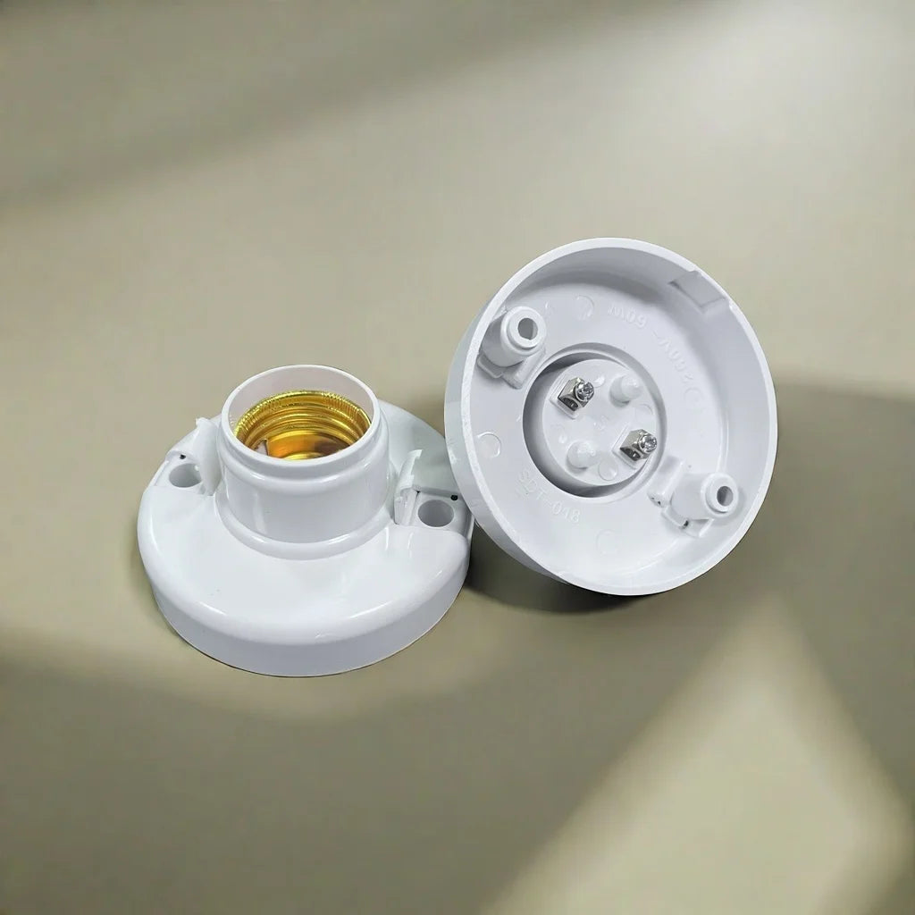 A white E27 screw cap light bulb holder with a threaded socket and internal contacts.
