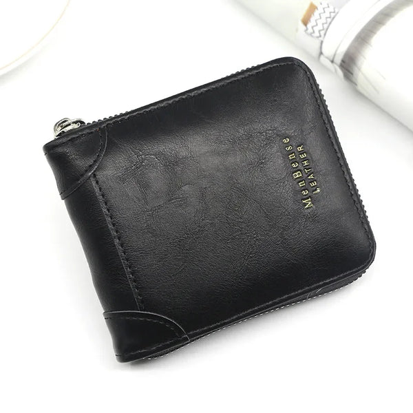 A black leather compact zipper wallet for men is shown on a white background.