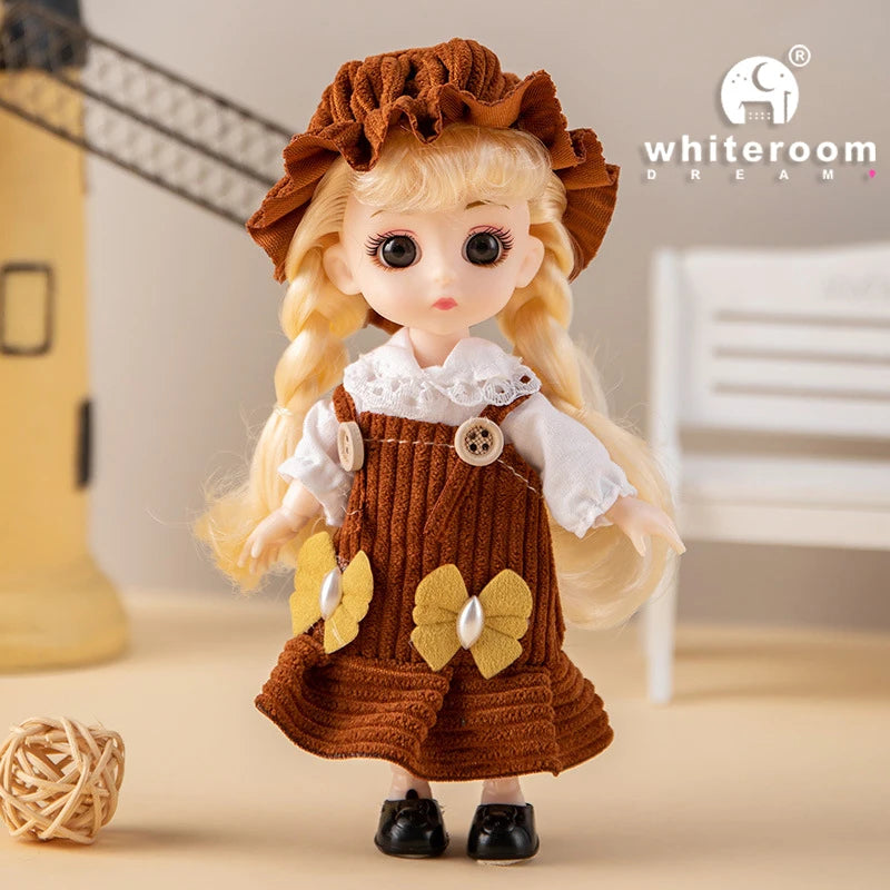 A brown-haired fashion doll with curly hair and a ruffled dress is shown against a light background.