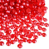 A pile of bright red faceted rhinestones and round sequins for DIY crafts and clothing decoration