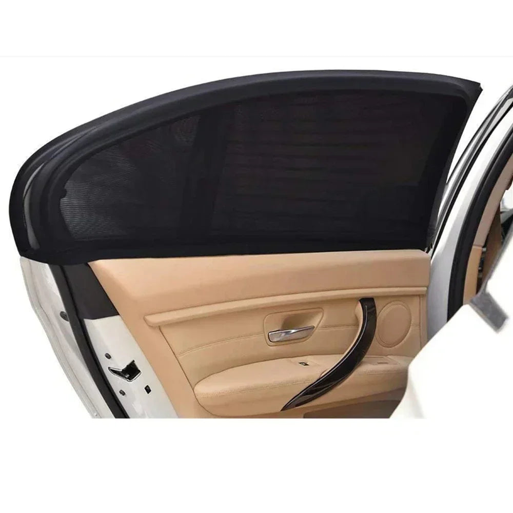 A black car side window sunshade with a mesh covering is shown in the interior of a vehicle.