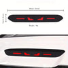 Black brake light sticker with red glow lines applied to a white car surface.