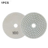 One piece of a diamond polishing pad, round and light beige, with a grid pattern.