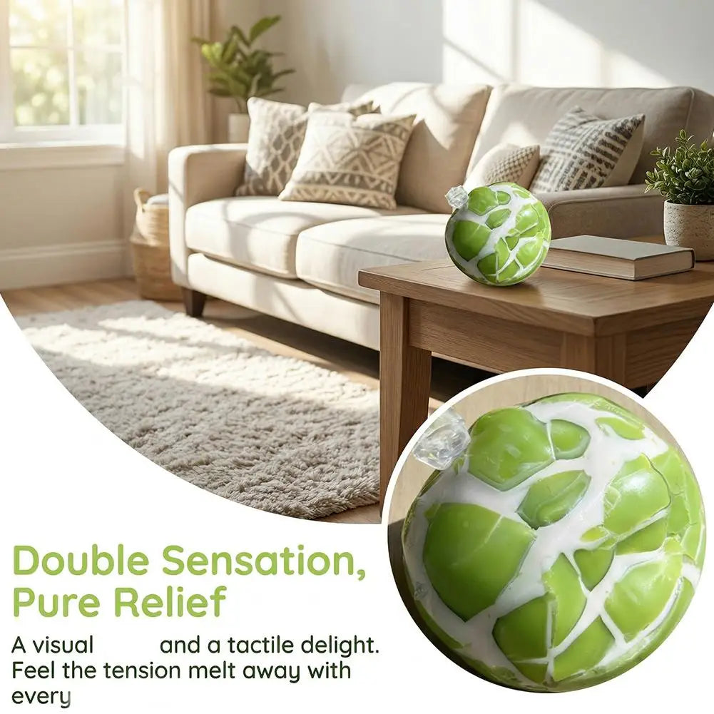 A green crackle sensory stress ball resting on a wooden table next to a sofa.