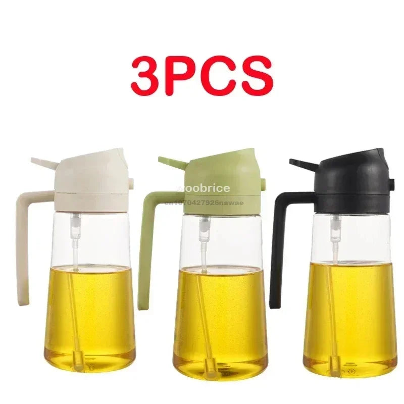 Three glass oil spray bottles with black and white tops for cooking