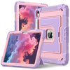 A pink and purple dual-color protective case for iPads is shown, with one tablet displaying a colorful cloud background.