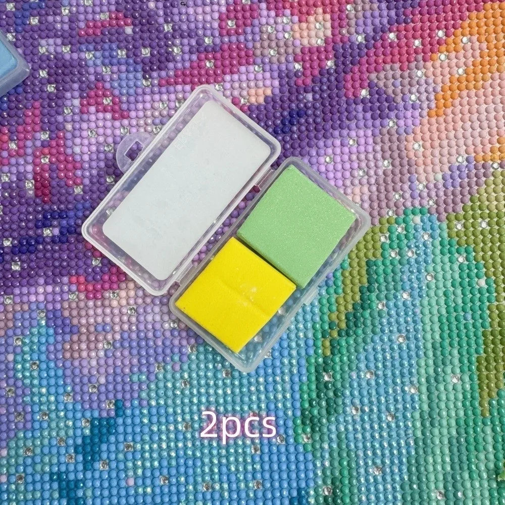 Two silicone diamond painting clays in white and lime green are displayed on a purple textured surface.