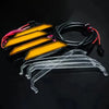 A kit of white LED grille lights for a Ford Ranger Raptor, including yellow light bars and clear mounting brackets.