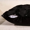 Black velvet throw pillow cover designed to look like a Halloween ghost with a pumpkin face.