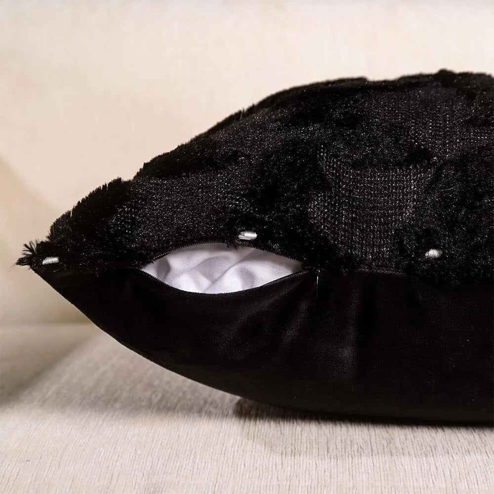 Black velvet throw pillow cover designed to look like a Halloween ghost with a pumpkin face.