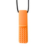 An orange silicone sensory chew necklace pendant with a black cord.