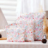 A set of reusable floral patterned waterproof wet bags with hanging hooks displayed on a white surface.