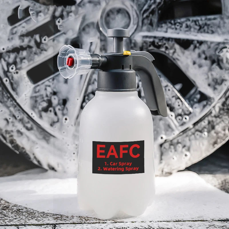 A white hand pump foam sprayer bottle with a black pump and nozzle is shown on a snowy surface.
