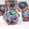 A close-up view of a translucent resin die with a dragon eye design and orange numbers on a white surface.