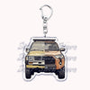 A silver metal key ring attached to a durable keychain featuring an off-road truck silhouette.