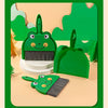 A green cartoon broom and dustpan set with a frog design on a light background.