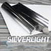 A roll of silverlight gradient car window tint film lying on a white surface.