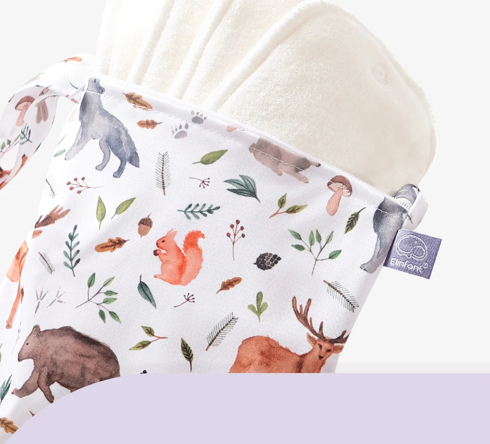 A white waterproof wet dry bag for baby is shown, featuring a pattern of woodland animals and greenery.