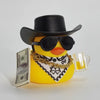 A yellow rubber duck shaped like a cowboy wearing a black hat and sunglasses, adorned with gold chains and a bandana.