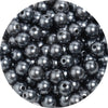 A close-up view of small, round, dark gray imitation pearl beads for jewelry making.