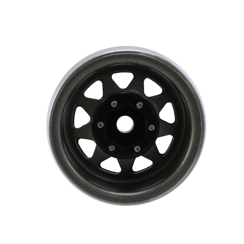 A black steel beadlock wheel for a 1/24 RC crawler.