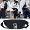 Black linen waist pack featuring a roaring dinosaur design worn by a person.