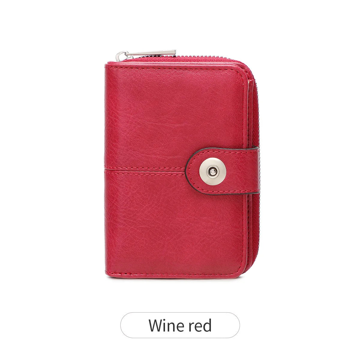 A vintage RFID blocking short wallet in wine red leather with a zipper closure.