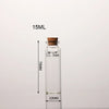 A clear glass bottle with a cork stopper, labeled 15ML, and measuring 70MM in height.