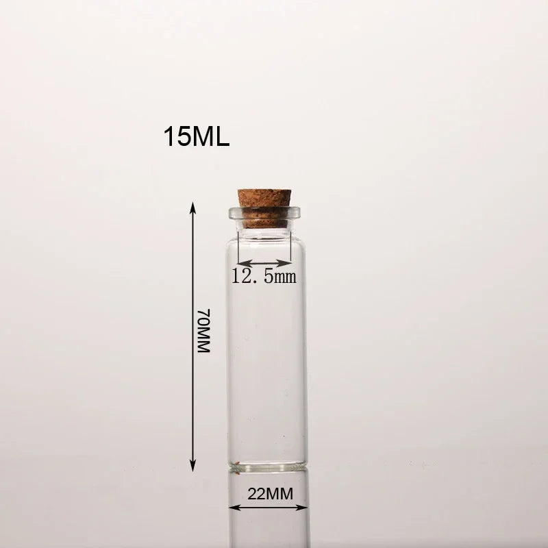 A clear glass bottle with a cork stopper, labeled 15ML, and measuring 70MM in height.
