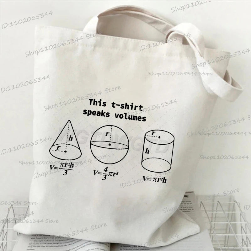 A white canvas tote bag featuring mathematical formulas for volume calculations of a t-shirt.
