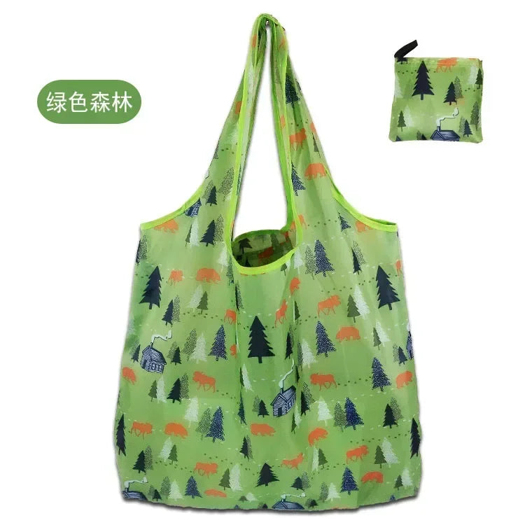 A lime green foldable shopping tote bag with a matching carry pouch featuring forest and animal patterns.