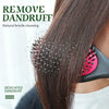 A close-up of a hand using a natural bristle cleaning tool on dark hair, demonstrating dandruff removal.