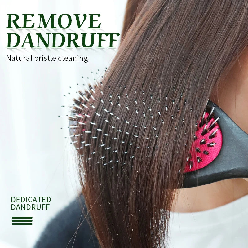 A close-up of a hand using a natural bristle cleaning tool on dark hair, demonstrating dandruff removal.