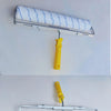 A paint roller with a white and blue textured cover is shown mounted on an aluminum alloy handle.