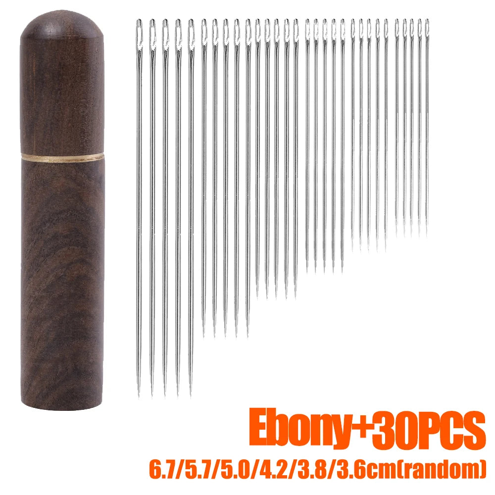 Ebony sewing needle set with 30 random size needles stored in a wooden cylinder