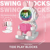 A pink and white set of Tide Play Blocks shaped like a rabbit, featuring a clear dome with colorful lights.