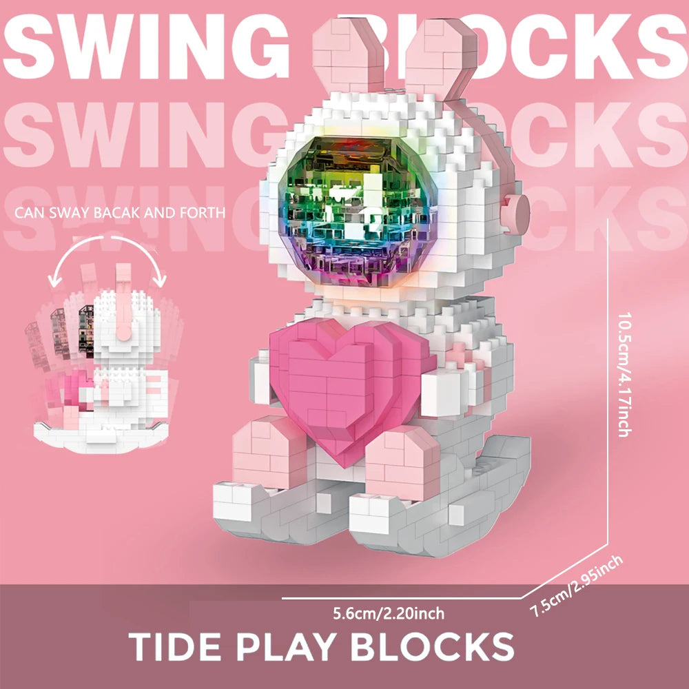 A pink and white set of Tide Play Blocks shaped like a rabbit, featuring a clear dome with colorful lights.