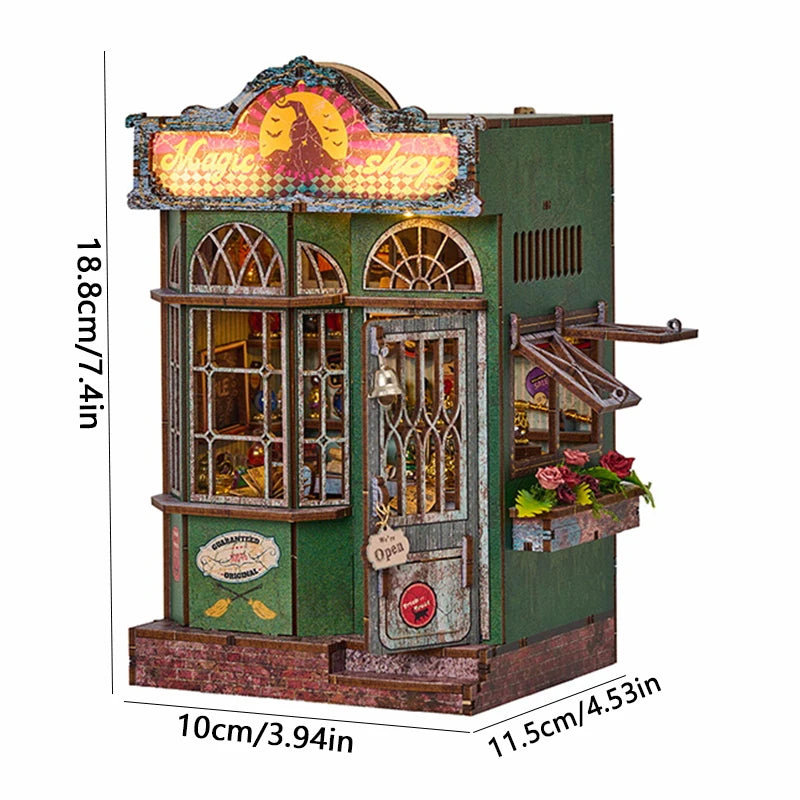 A miniature DIY book nook kit featuring a detailed shop facade with glass windows and a sign.
