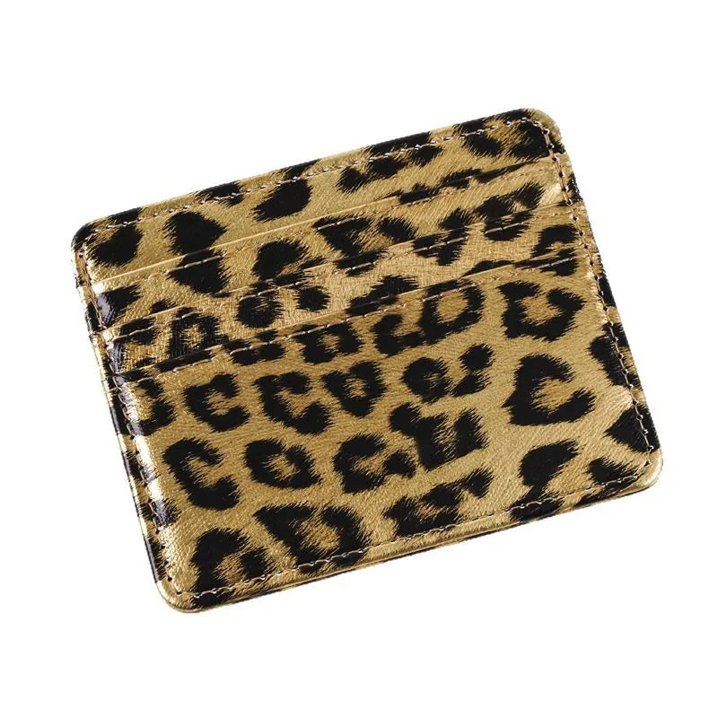 A brown and black leopard print PU leather card wallet.