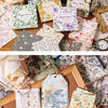 A collection of vintage floral scrapbook paper sheets in various patterns and colors for journaling and crafts.