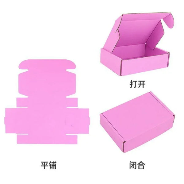 Three pink corrugated packing boxes shown: one flat box, one open box, and one assembled box.