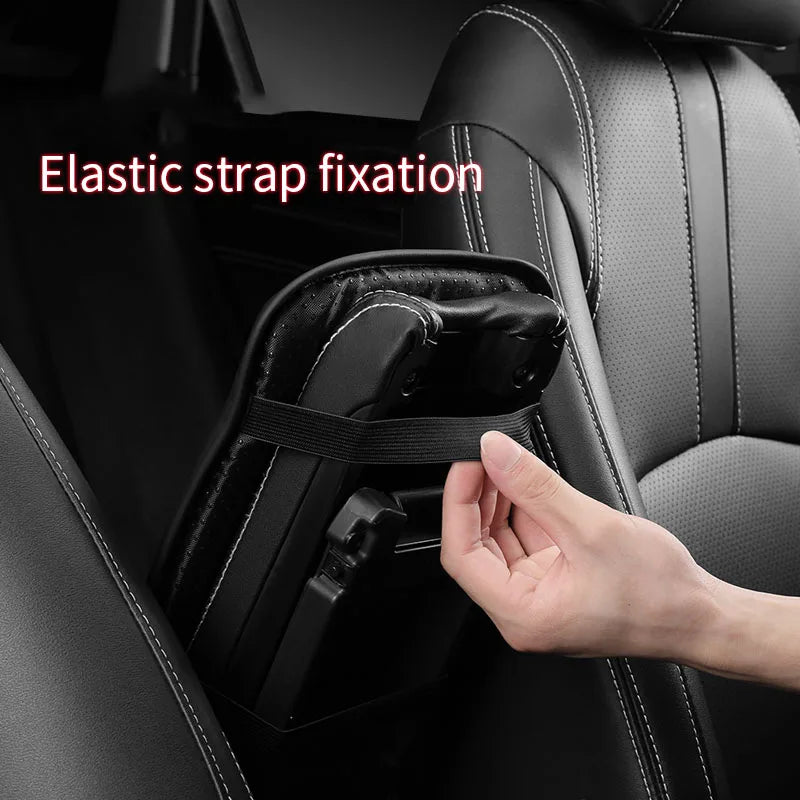 Main adjusting an elastic strap fixation on a black car armrest cushion cover.