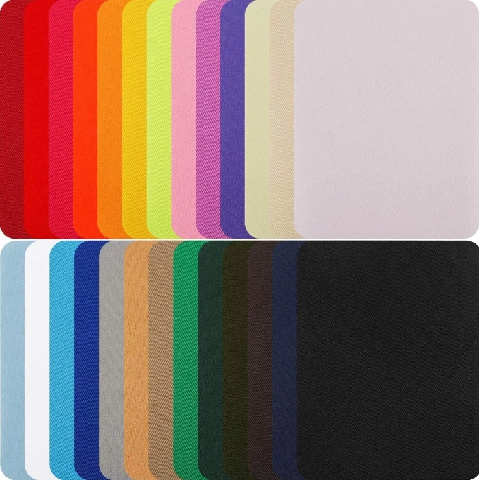A collection of colorful and neutral iron-on fabric patches displayed in a row.