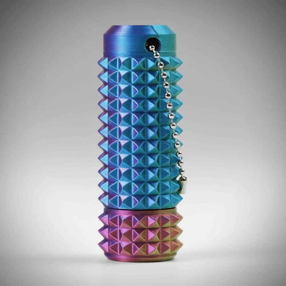 A vibrant blue and purple spiky sensory fidget roller with a silver chain hanging from the top.