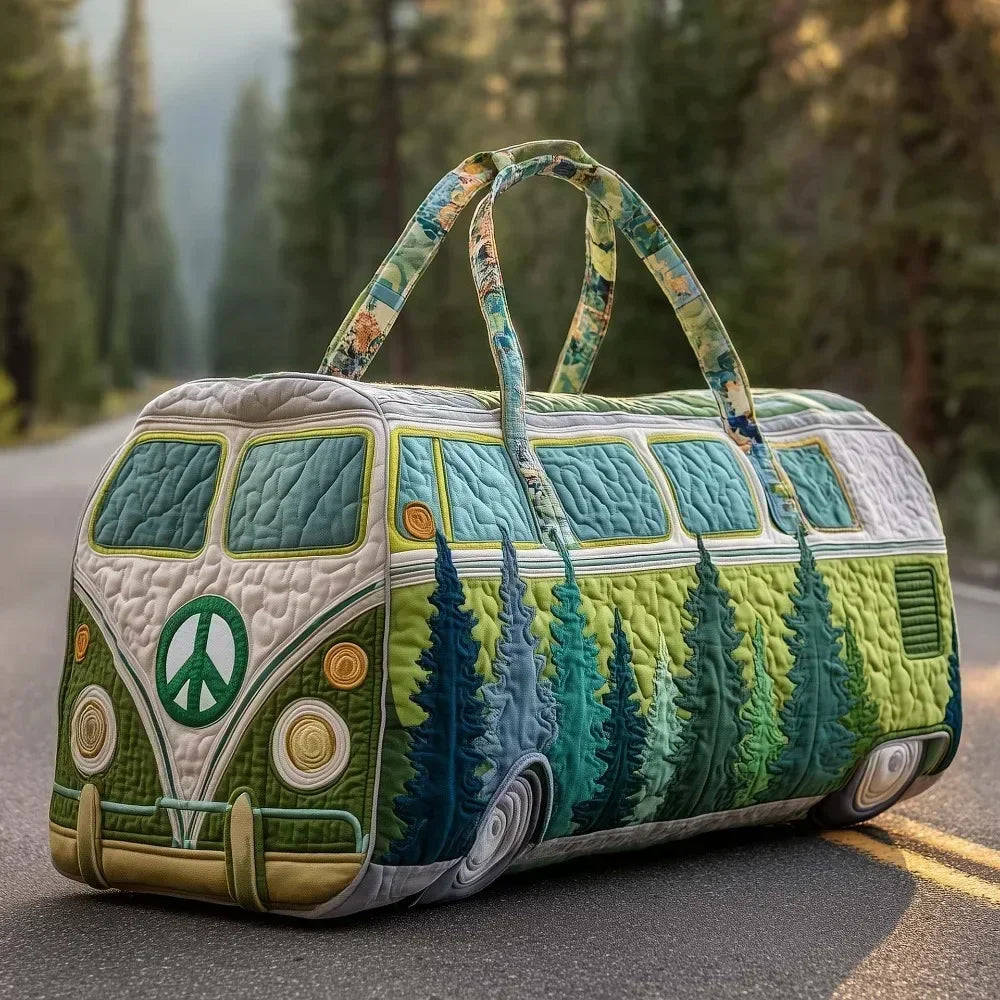 A quilted green and white travel duffle bag with olive green straps resting on an asphalt road.